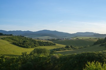 Fototapeta premium Sunrise and sunset over the hills and town. Slovakia