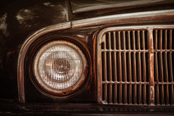 Fototapeta premium Old rusty car bumper and lamp