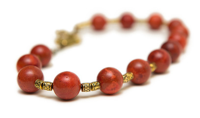 Nice necklace with red beads isolated on white background