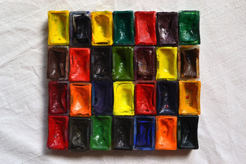 Composition of tubes of multi-colored watercolor paints
