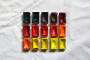 Composition of tubes of multi-colored watercolor paints