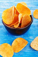 potato chips in a clay plate