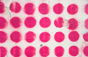 A fragment of painted plastered walls painted in pink circle. Background, texture