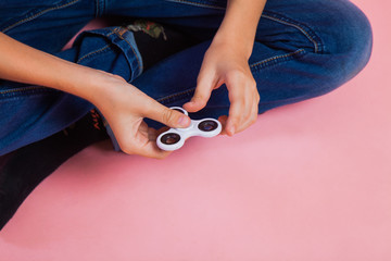 Teen boy with popular toy fidget spinner