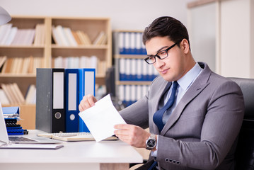 Businessman receiving letter in the office