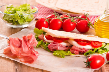 Piadina with ham and lettuce. 