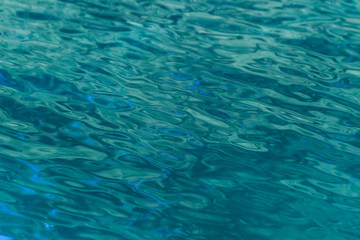 Fototapeta na wymiar waving, blue water surface