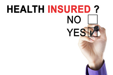 Businessman's hand approving health insured