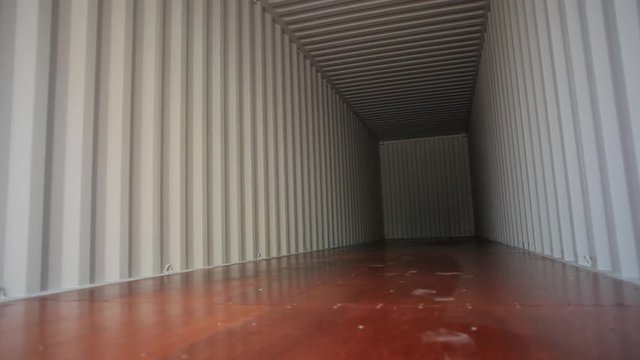 Inside an empty shipping 40ft container. Pan