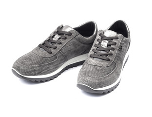 Gray female suede sneakers isolated on white background with clipping path