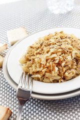 Fried cabbage with caraway and garlic on a plate
