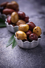 Bowls with different Mediterranean olives