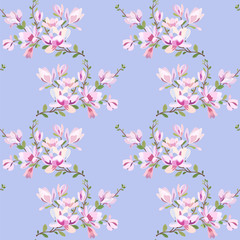 Seamless floral pattern with a branch of a blooming magnolia on a blue background