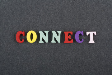 CONNECT word on black board background composed from colorful abc alphabet block wooden letters, copy space for ad text. Learning english concept.