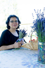 Hispanic Woman Creating Lavender Flower Bouquet