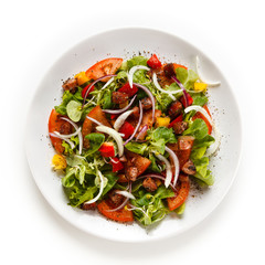 Salad with smoked ham on white background 