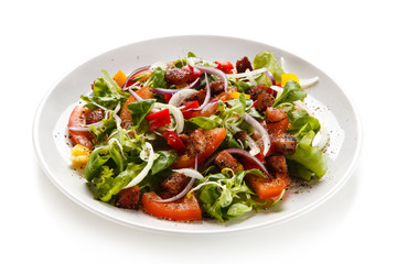 Salad with smoked ham on white background 