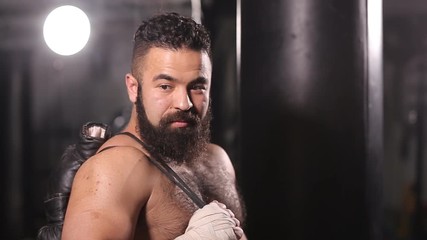 Portrait of a boxer with gloves for boxing. Man after kickboxing training