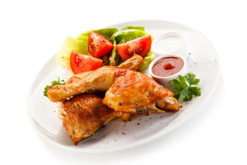 Roast chicken legs on white background 