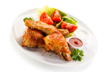 Roast chicken legs on white background 