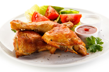 Roast chicken legs on white background 