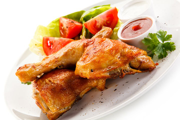 Roast chicken legs on white background 