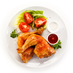 Roast chicken legs on white background 