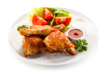 Roast chicken legs on white background 