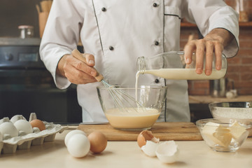 Bakery chef cooking bake in the kitchen professional