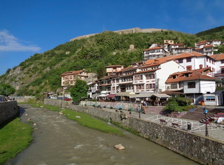 Fototapeta na wymiar The Prizren Bistrica river flows through Prizren old city centre in a beautiful sunny day, Kosovo 