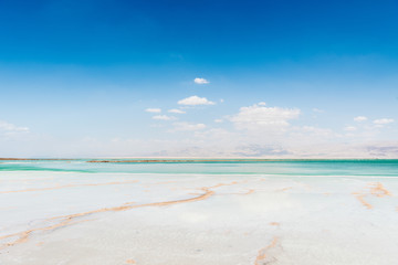 View of Dead Sea coastline. Salt crystals. Texture of Dead sea. Salty sea shore