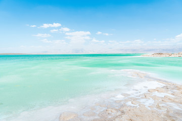 View of Dead Sea coastline. Salt crystals. Texture of Dead sea. Salty sea shore
