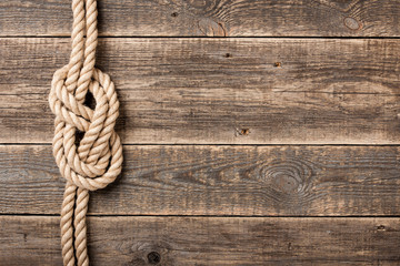 Rope knot on wooden board