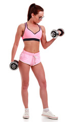 Fototapeta premium Clever girl in glasses with dumbbells, isolated on clear white background