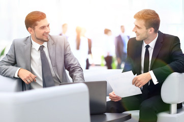 Fototapeta premium Image of business partners discussing documents and ideas at mee