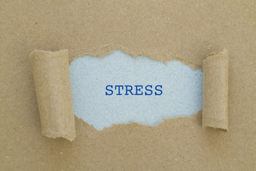 Stress word written under torn paper.