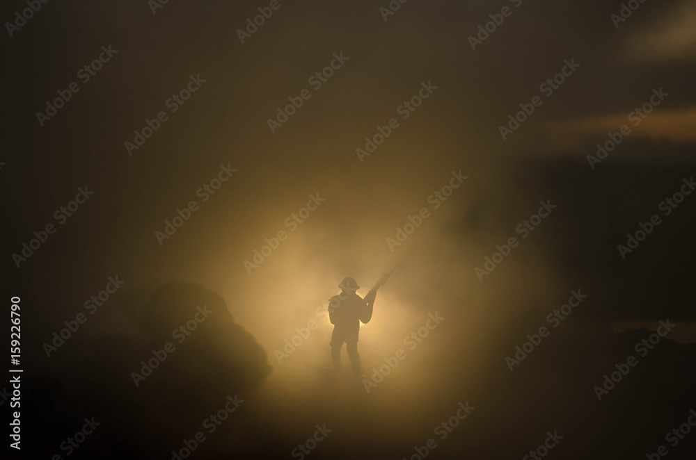 Wall mural War Concept. Military silhouettes fighting scene on war fog sky background, World War Soldiers Silhouettes Below Cloudy Skyline At night. Attack scene. Armored vehicles. Tanks battle