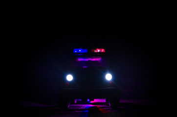 speed lighting of police car in the night on the road. Police cars on road moving with fog. Selective focus. Chase © zef art