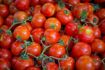 Fresh organic tomatoes at outdoor market. Top view. Close-up