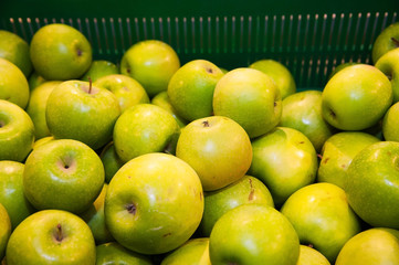 Apples on boxes in supermarket