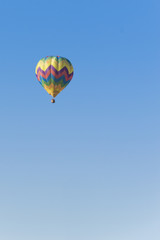 Isolated Hot Air Balloon in a blue sky