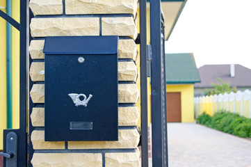 Mailbox on the gate at the entrance to the courtyard