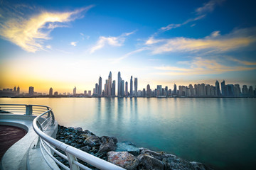 The beauty panorama of skyscrapers in Dubai from promenade at sunrise. UAE