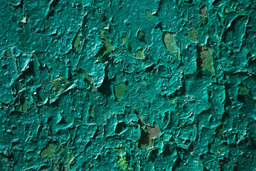 background of green paint coat peeling and cracking from wall