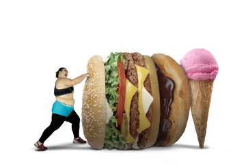 Obese woman punching fast foods