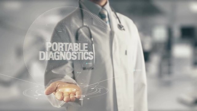 Doctor holding in hand Portable Diagnostics