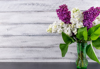 lilac flowers on wooden background. cover, card. copy space.