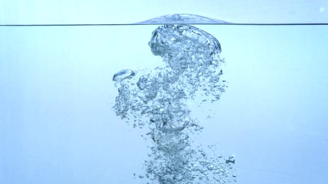 water bubbles rising from the depths in slow motion.