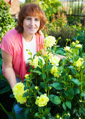Woman in the garden cares for flowers