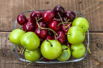 Cherry and green plums in wonderful looking dish, cherry and plums in summer fruit
